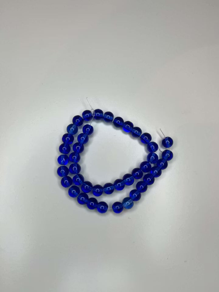 Sträng med glaspärlor lila/mörkblå, 8mm