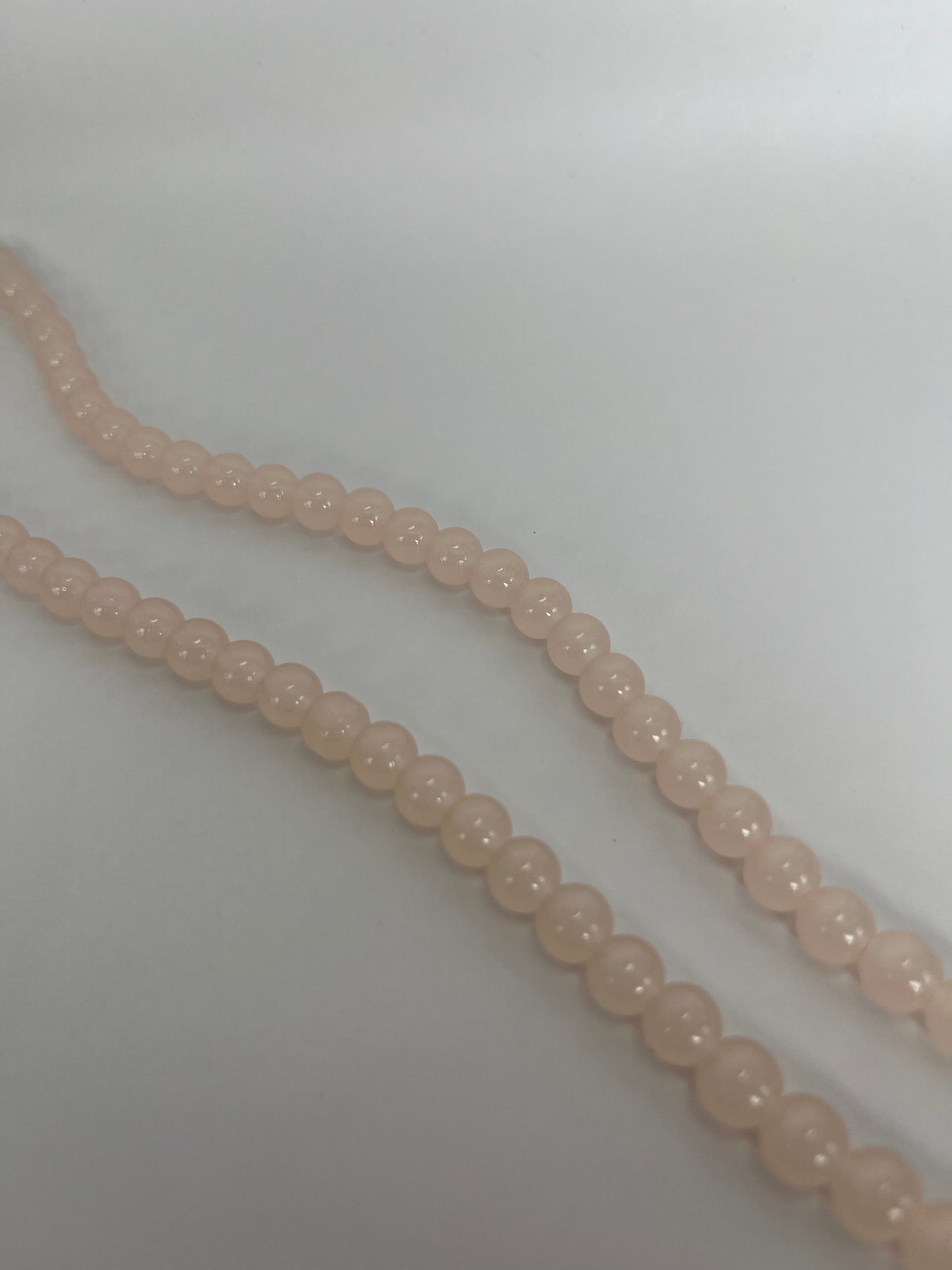 Sträng med ljusrosa glaspärlor, 8mm