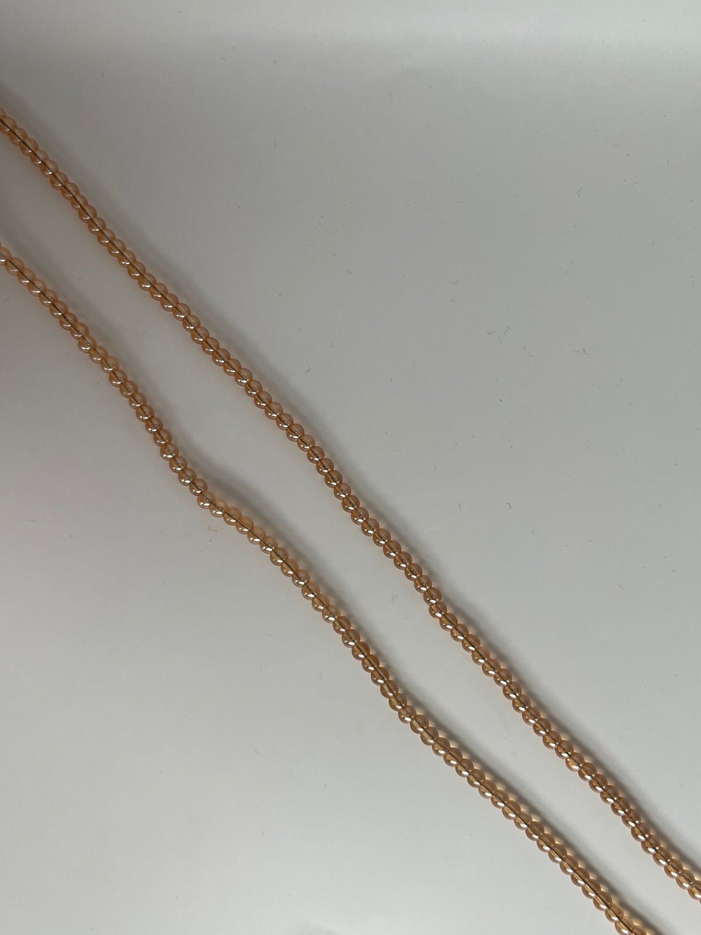 Sträng med guldiga glaspärlor, 4mm