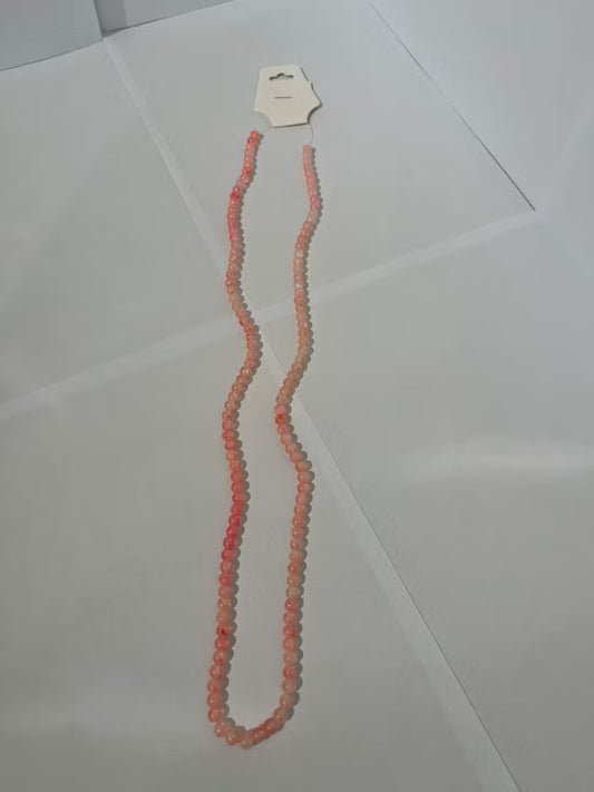 Sträng med glaspärlor i färgen Orang/Rosa färg 6mm (133st)