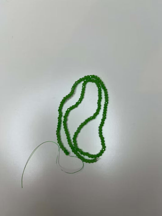 Sträng med facetterade glaspärlor Grön 4mm