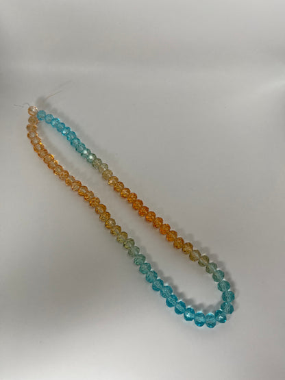 Sträng med kristallpärlor blåoranga, 8mm (ca75st)