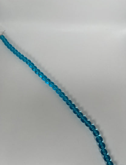 Sträng med runda glaspärlor, ljusblåa, 8 mm