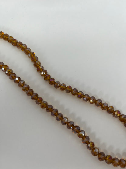 Sträng med kristallpärlor bruna/guldiga, 8mm (ca65st)