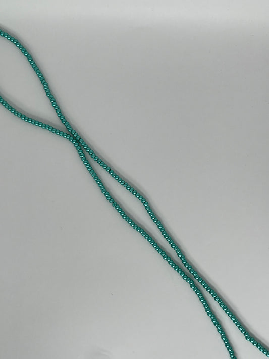 Sträng med vaxade glaspärlor mörkgrön, 3mm
