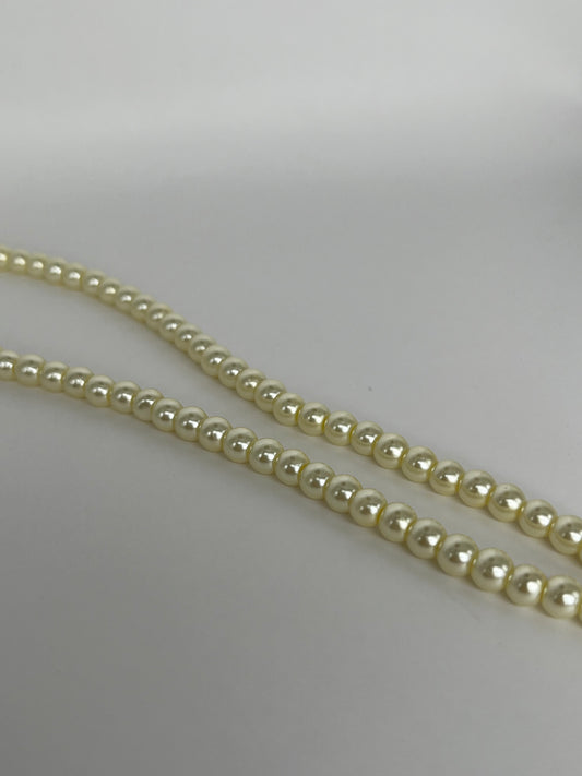 Sträng med vaxade glaspärlor ljusgul, 6mm