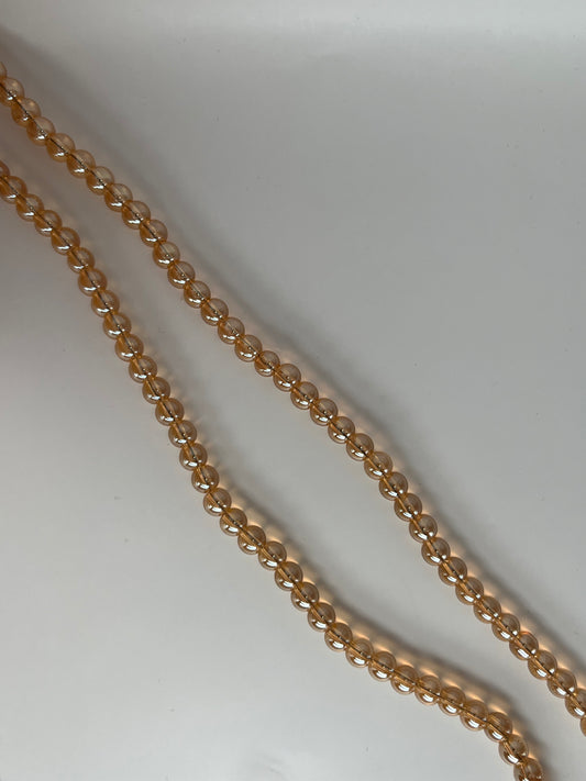 Sträng med guldiga glaspärlor, 8mm