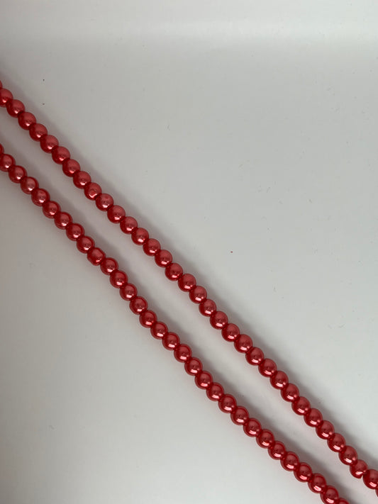 Sträng med vaxade glaspärlor ljusröd, 8mm